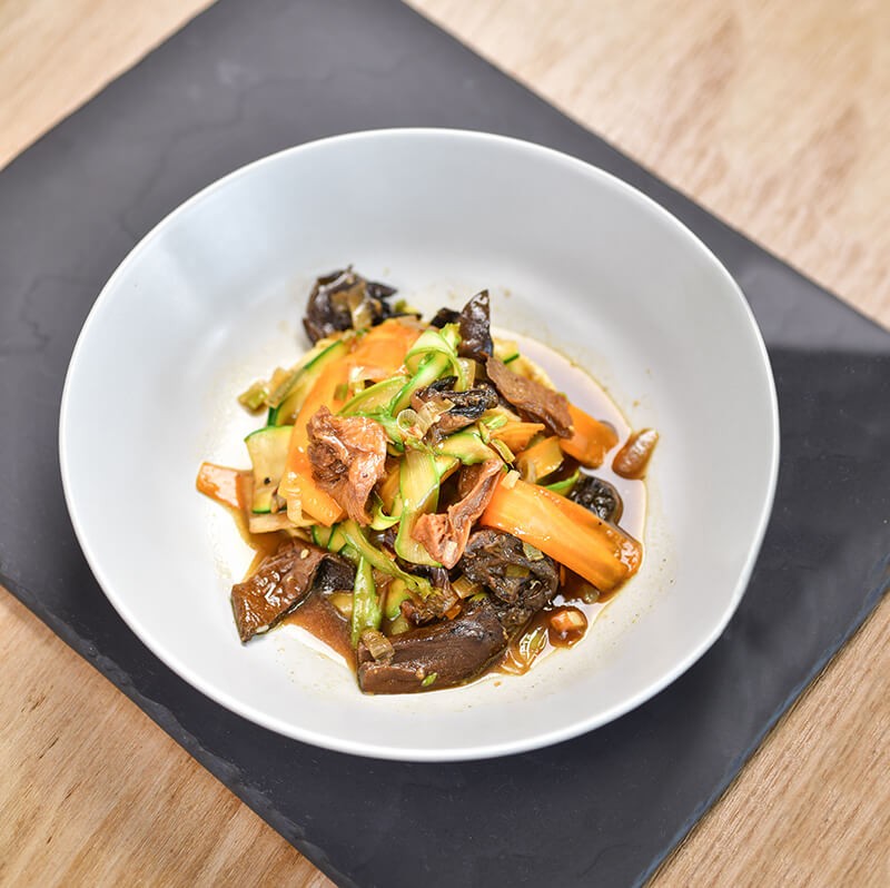 Wok of vegetables with dried slippery jack and porcini